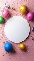 Balloons and confetti frame a blank space for a celebration invitation or greeting card photo