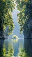 A tranquil river surrounded by lush greenery and steep cliffs during the early morning light photo