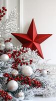 Holiday decorations featuring a red star ornament and festive embellishments on a white background photo