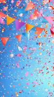 Colorful party decorations and confetti create a festive atmosphere on a clear blue day photo