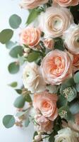 Elegant arrangement of soft peach and white roses with greenery for a spring celebration photo