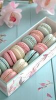 Freshly made colorful macarons arranged neatly in a decorative box on a wooden table photo