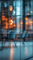 A modern office interior setup featuring stylish chairs and warm ambient lighting in the evening photo