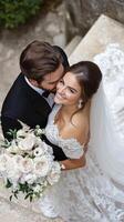 A joyful couple celebrates their wedding day with a beautiful bouquet in a charming outdoor setting photo
