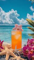 Tropical cocktail garnished with orchids beside soft sand on a bright sunny day photo