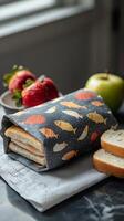 Freshly baked bread and apples displayed in a decorative basket on a rustic table photo