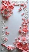 Elegant pink floral frame crafted with intricate paper art for decoration or invitations photo