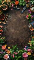 A vibrant garden path surrounded by blooming flowers and gardening tools placed on rich soil photo