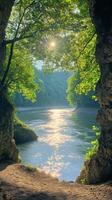 A tranquil river surrounded by lush greenery and steep cliffs during the early morning light photo