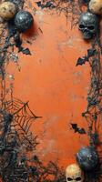 Spooky Halloween decorations featuring bats, skulls, and spider webs on an orange background photo