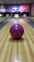 Bowling ball rolls towards pins in a bowling alley during a weekend outing photo