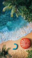 Serene beach with turquoise water and colorful umbrella during a sunny day in a tropical paradise photo