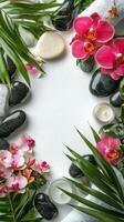 A serene spa setting with flowers, stones, and candles on a calming white surface photo