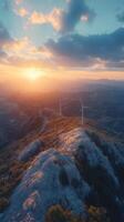 Sunrise over a mountain landscape with wind turbines in a serene valley vista photo