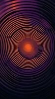 Swirling orange and purple concentric circles creating an abstract pattern at night photo