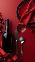 Romantic dining setup with red decor, wine, and a plate ready for a special occasion photo