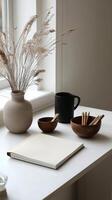 Cozy dining setup with wooden tableware and decorative vase in sunlit kitchen photo
