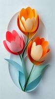 Colorful paper flowers with cut out petals on a light background in an artistic display photo