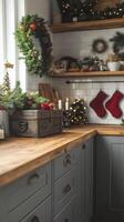 Cozy holiday decor featuring stockings and a rustic box on a kitchen countertop in winter photo
