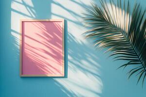 Colorful square canvas against a bright blue wall with palm shadows in a sunny environment photo