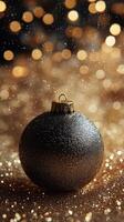 This holiday ornament, adorned with intricate designs, sits on a bed of glittering beads photo