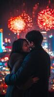A couple embraces during a vibrant fireworks display in a lively city at night photo