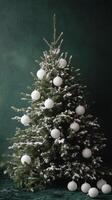 Decorated Christmas tree with white ornaments on a green background in winter celebration photo