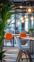 Modern office workspace featuring an ergonomic chair and green plants in a bright environment photo
