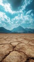 Expansive desert landscape under a bright blue sky with distant mountains on a sunny day photo