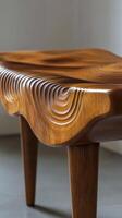 Unique wooden table with intricate wave design and elegant legs in a modern interior setting photo