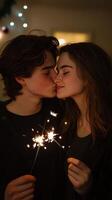 Young couple enjoying a cozy winter evening with sparkler in hand near festive decorations photo