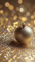This holiday ornament, adorned with intricate designs, sits on a bed of glittering beads photo