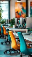 Stylish modern office workspace featuring colorful chairs and sleek computers in a vibrant setting photo