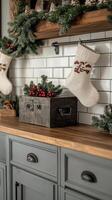 Cozy holiday decor featuring stockings and a rustic box on a kitchen countertop in winter photo