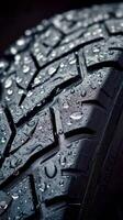 Close up of tire tread with water droplets highlighting texture and performance features photo