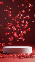 Floating rose petals cascade over a circular pedestal against a pink background photo