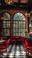 Cozy cafe interior with red chairs and large windows overlooking a vibrant street view photo