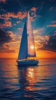 Beautiful sailboat gliding across calm waters during sunset with vibrant clouds photo