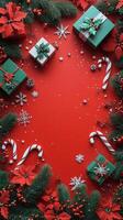 Festive holiday decorations with presents and candy canes on a vibrant red background photo