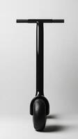 A modern black electric scooter on a plain background designed for urban commuting and leisure photo