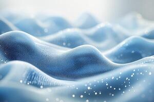 Gentle waves of blue fabric create a serene atmosphere with soft textures and glittering details photo