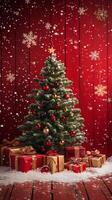 Christmas tree adorned with red ornaments and wrapped gifts in a festive setting photo