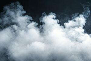 Thick white smoke drifts over a dark background, creating a mysterious surreal atmosphere photo