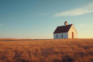 A solitary white house stands in a golden field under a dramatic sky at sunset photo