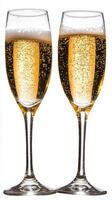 Elegant champagne flutes filled with sparkling beverage during a celebration in clear light photo