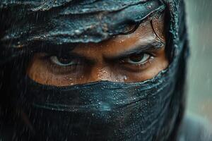 A masked warrior stands in the rain, eyes fixed with determination during an intense battle photo
