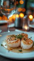 Grilled scallops served on a plate with herb garnish in a cozy restaurant during dinner photo