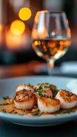 Grilled scallops served on a plate with herb garnish in a cozy restaurant during dinner photo