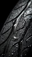 Close up of tire tread with water droplets highlighting texture and performance features photo