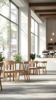 Bright and airy modern caf interior with wooden furniture and large windows during the day photo